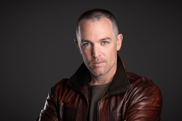Actor's Headshot of Adelaide's Brad Angel, on a grey background