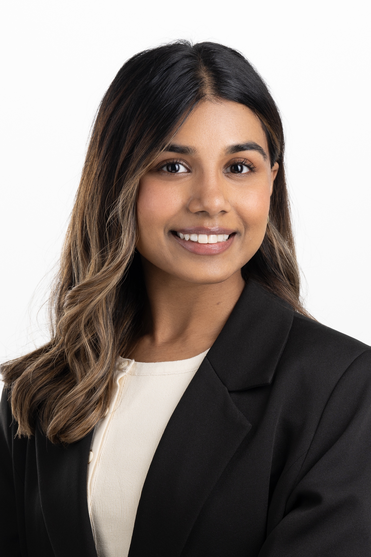 headshot of a young woman in corporate clothing