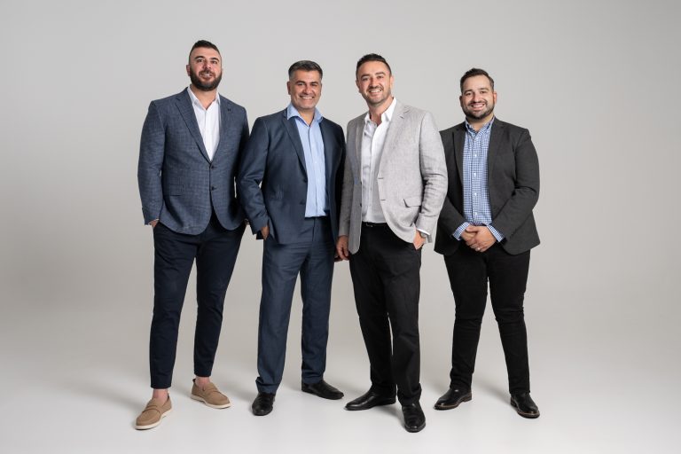 Axia Finance corporate group photo in the studio