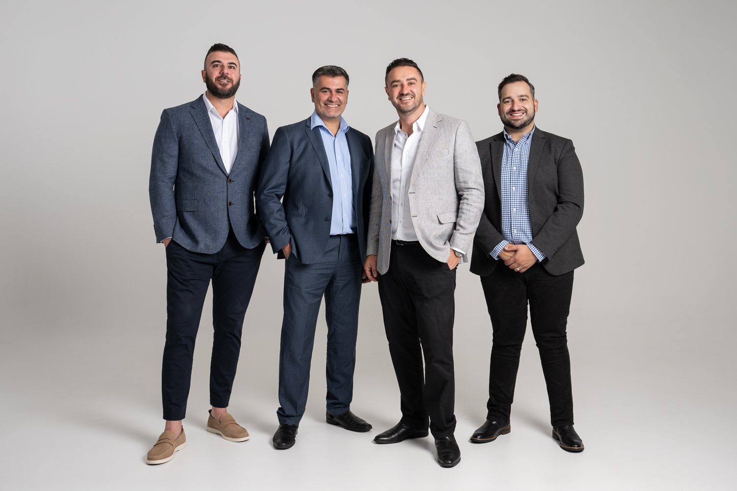 Axia Finance corporate group photo in the studio