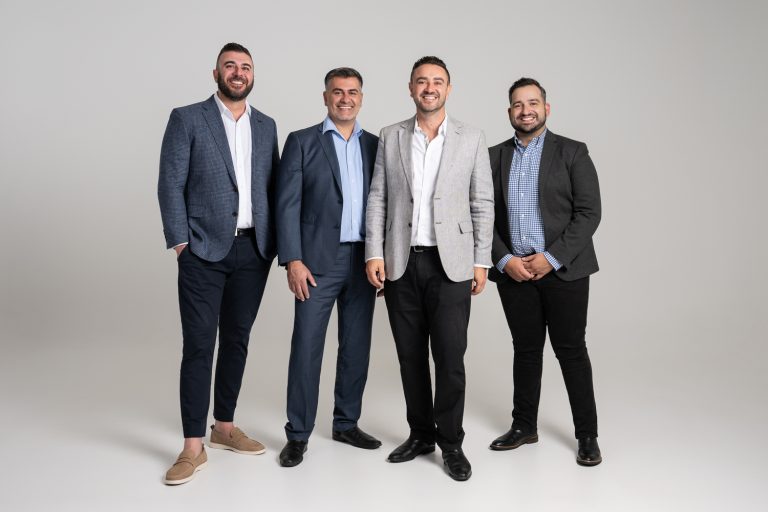 Axia Finance group photo in the studio