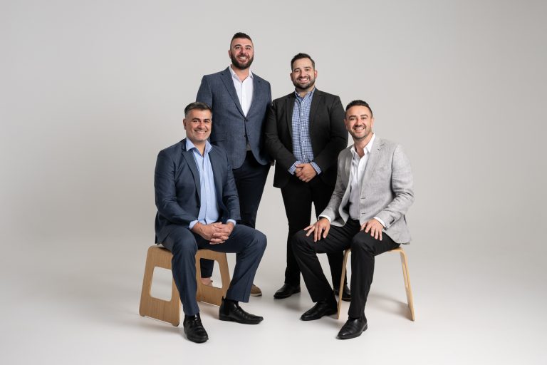 Axia Finance corporate group photo in the studio