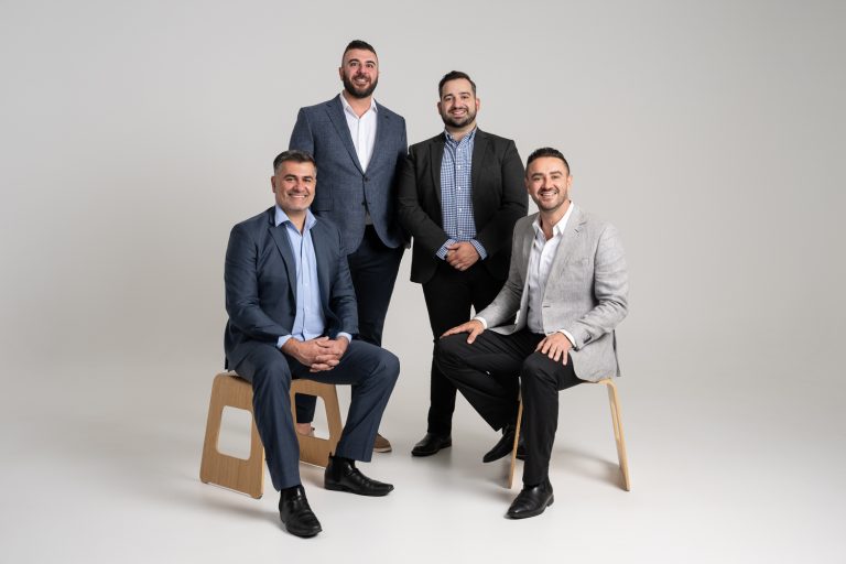 Axia Finance corporate group photo in the studio