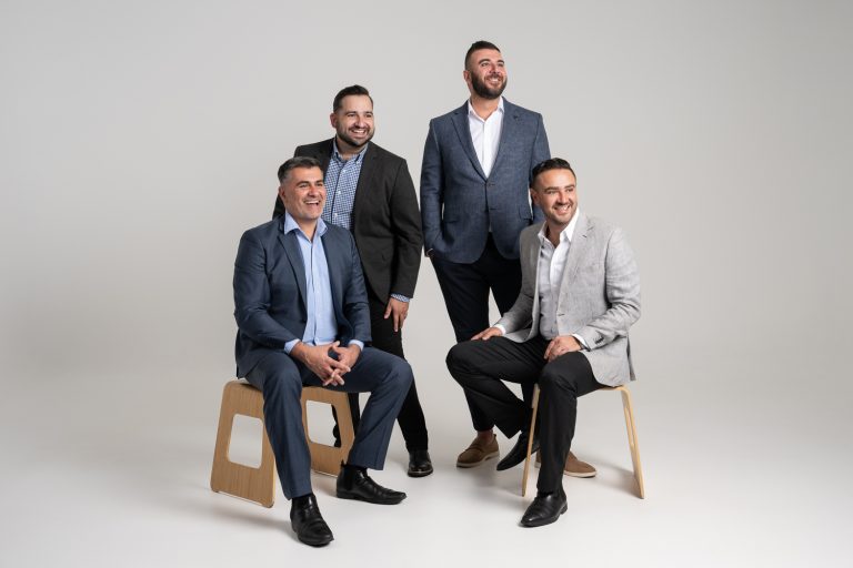 Axia Finance corporate group photo in the studio