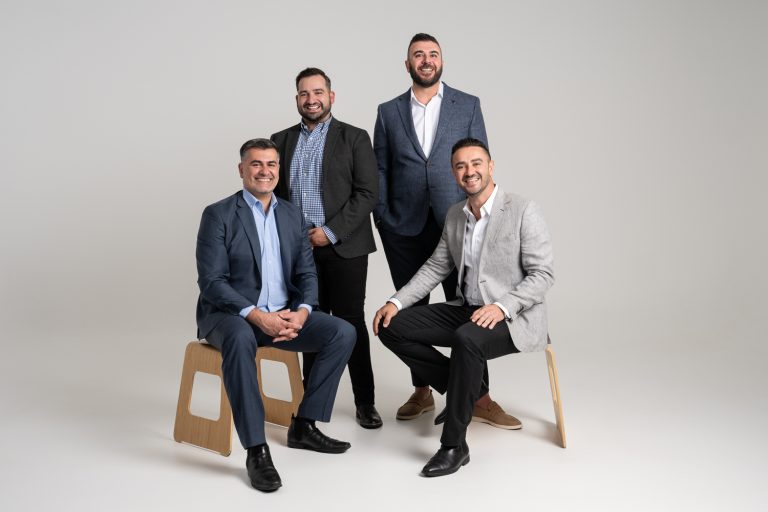 Axia Finance corporate group photo in the studio