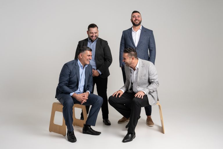 Axia Finance corporate group photo in the studio